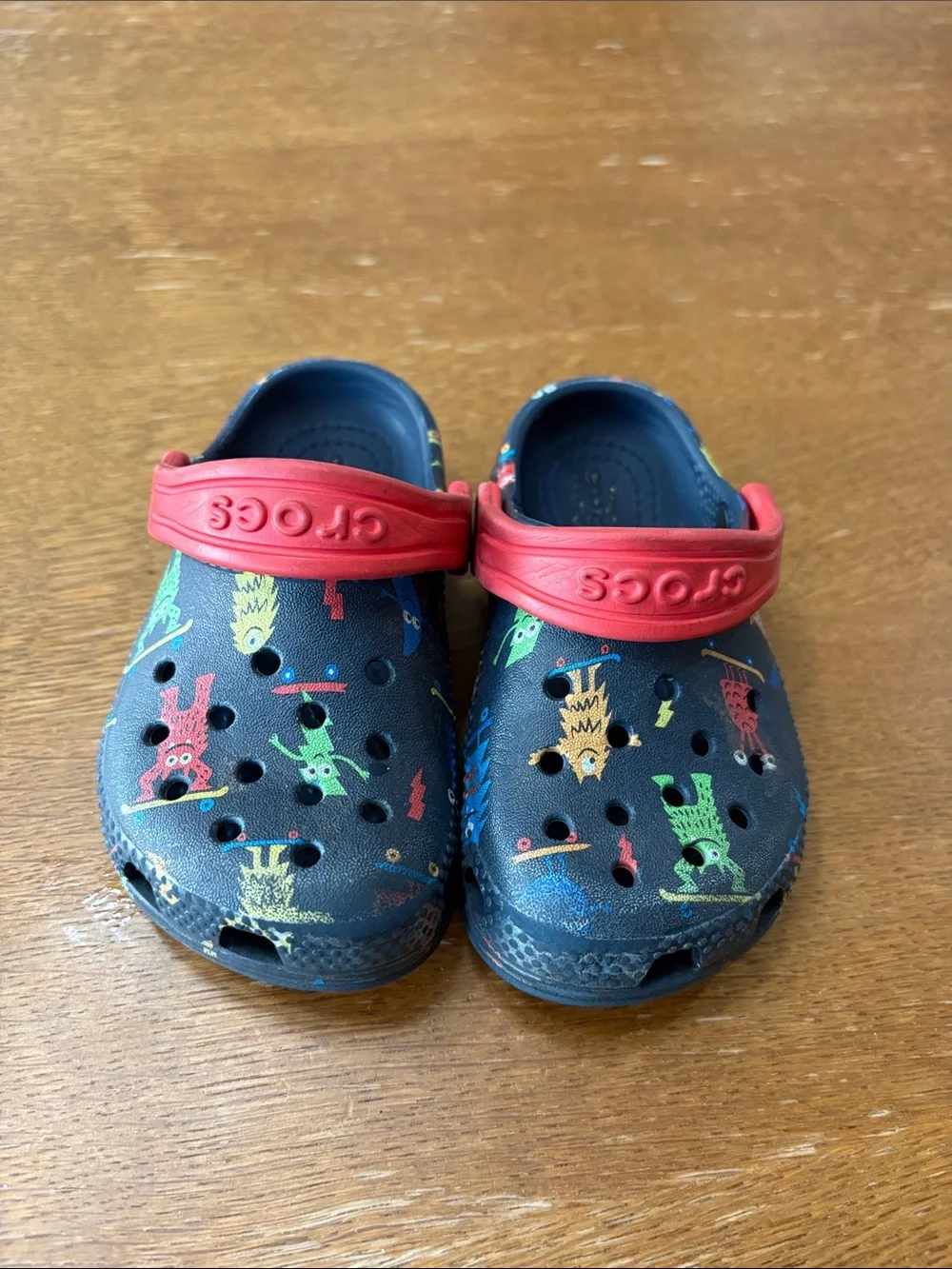CROCS Navy Kids Clog with Red Strap and Multicolor Monster Print